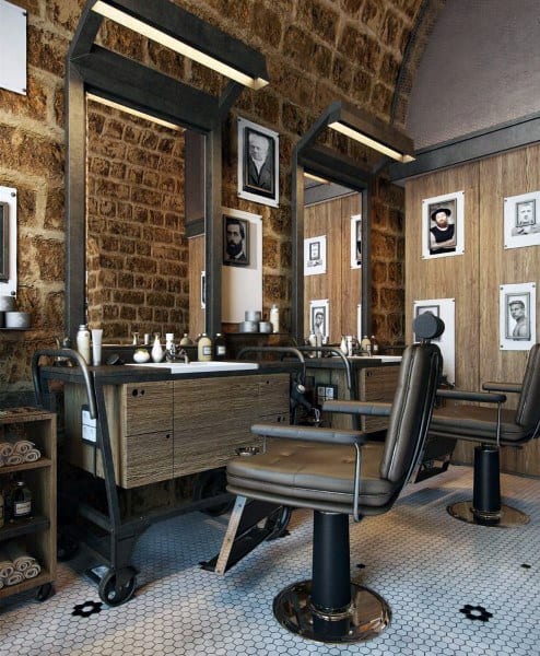 Rustic barbershop with exposed brick walls, vintage leather chairs, and framed black-and-white portraits.