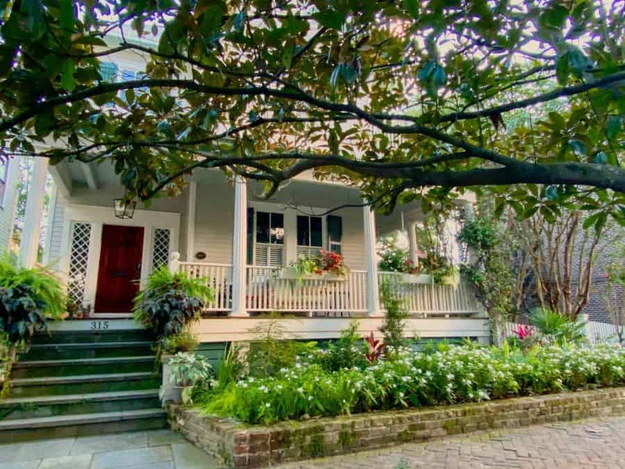 large country home brick garden bed front yard