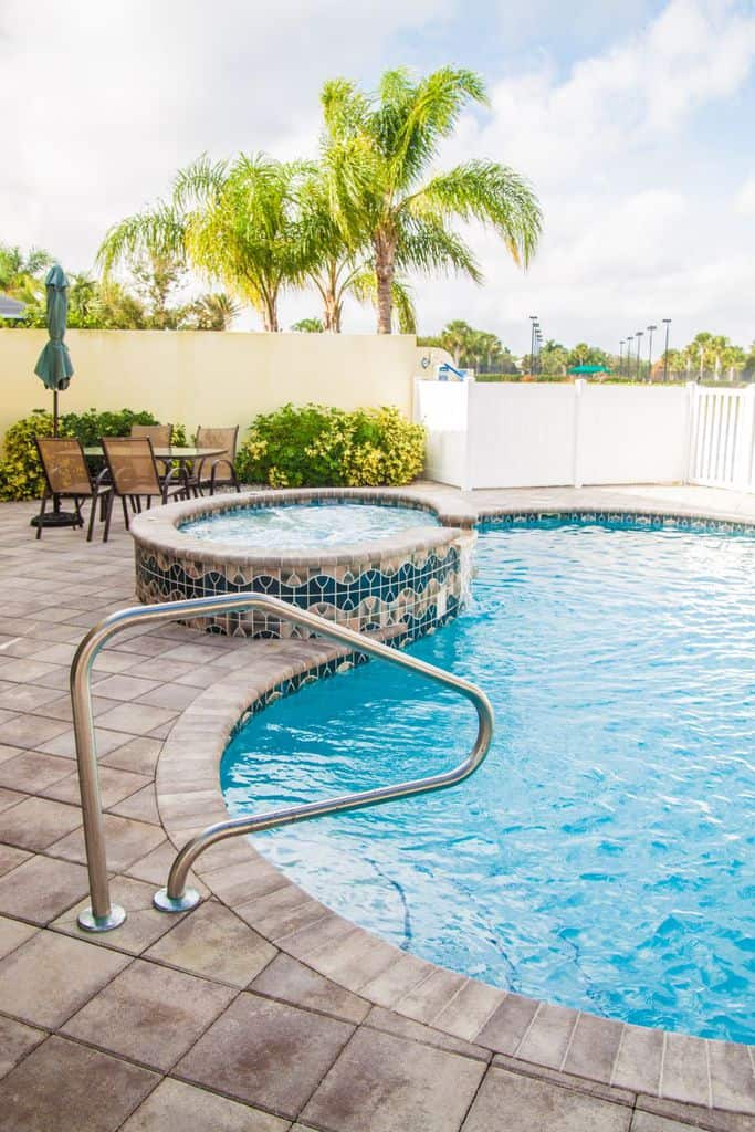 paver pool patio with spa