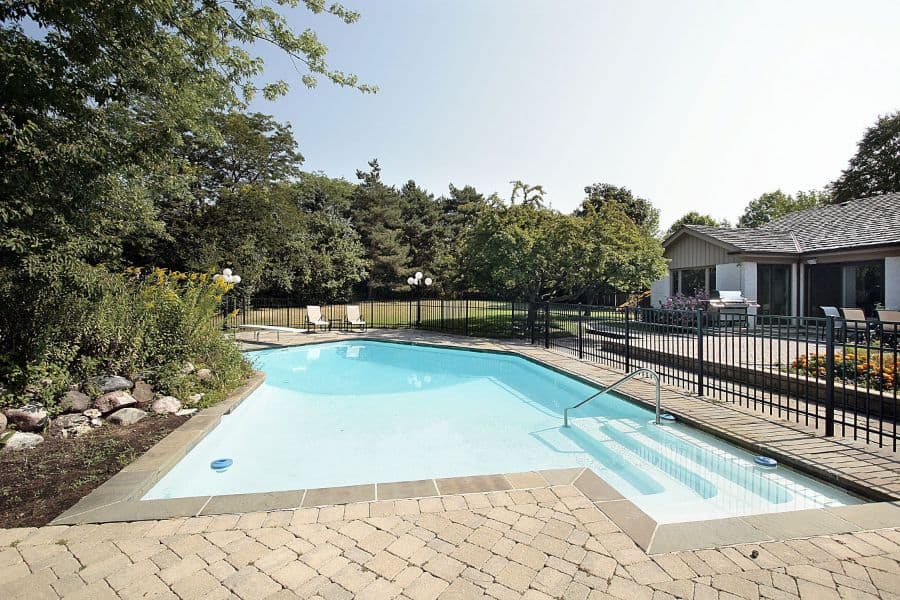 fenced off paver pool deck
