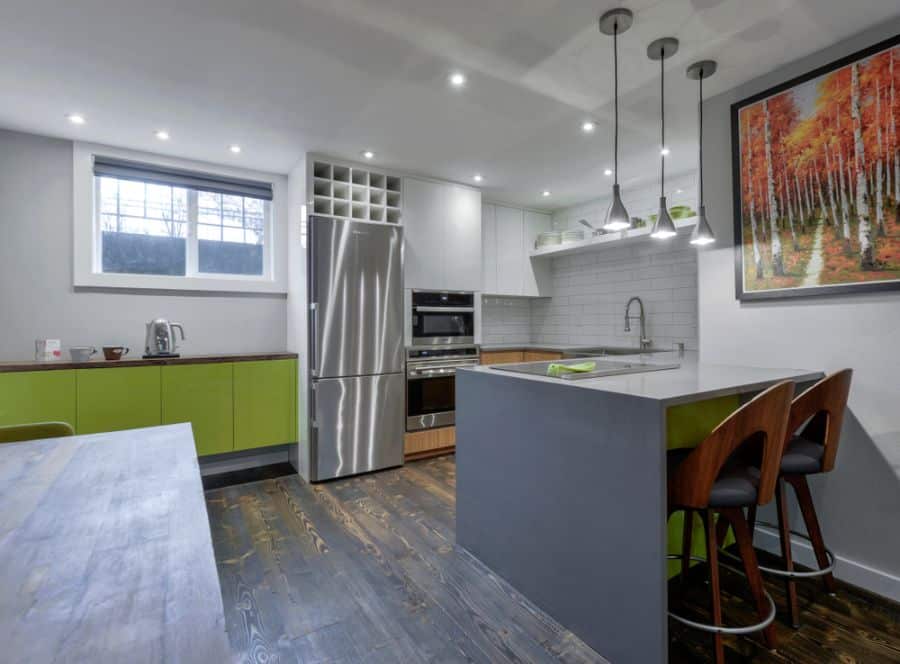 green cabinets gray island kitchen
