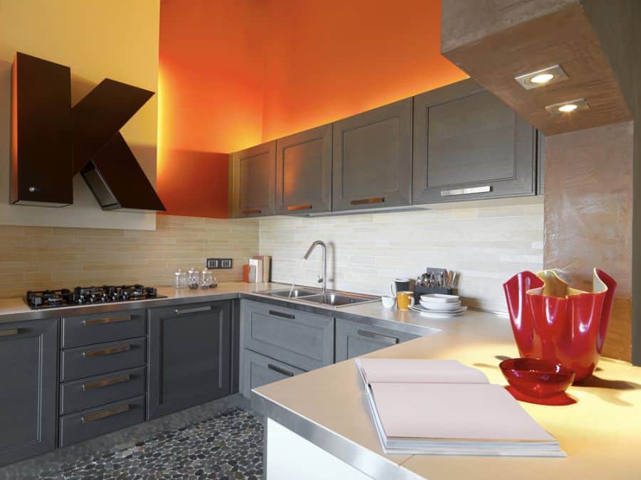bright orange wall gray cabinets kitchen