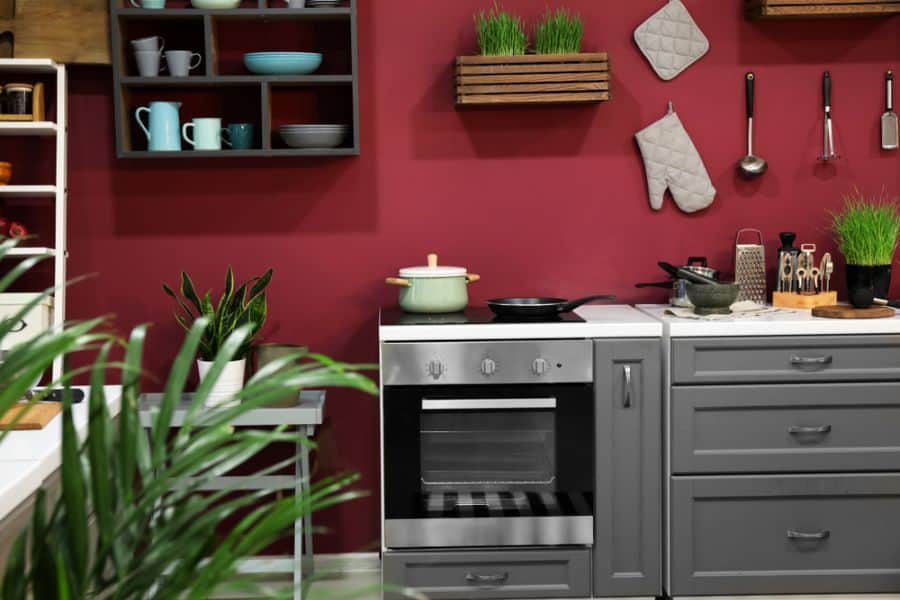red accent wall modern gray cabinet kitchen