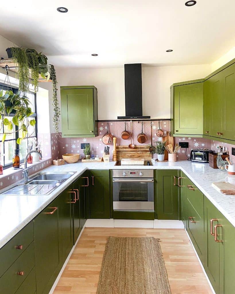 green cabinet kitchen pink tile backsplash