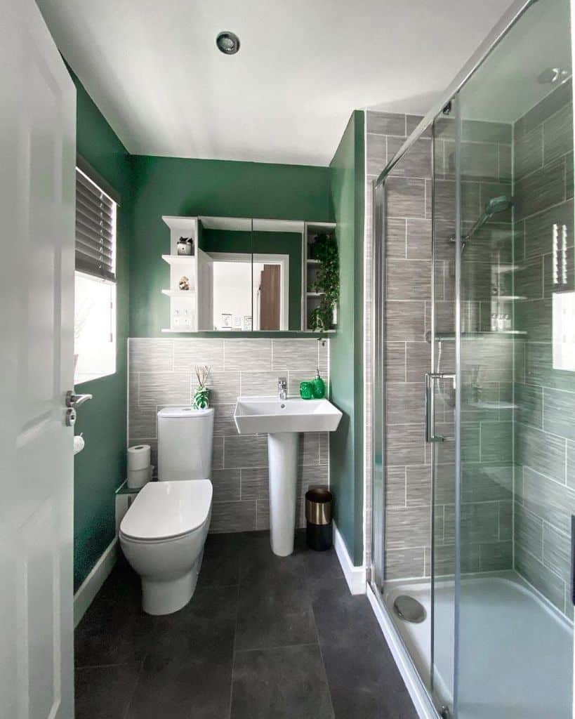 green paint and gray tile bathroom 