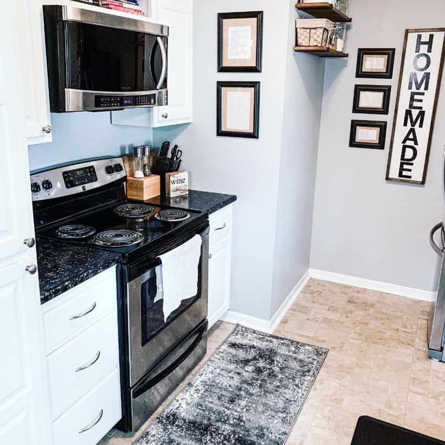 white cabinet kitchen brown floor tiles framed wall art