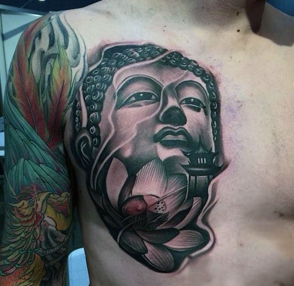 Buddha Head Tattoo With Green Leaves On Chest For Men