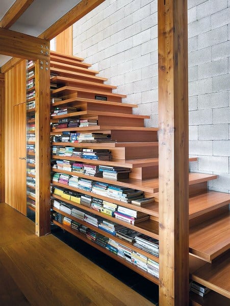 built-in wood staircase under stairs shelves