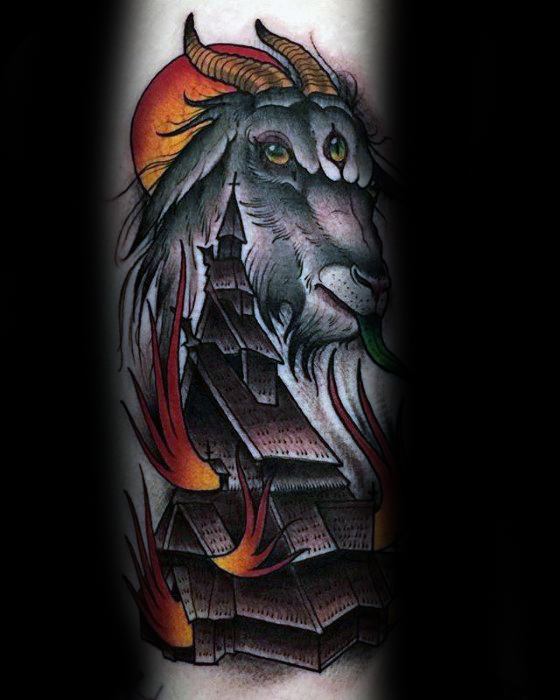 Burning wooden church tattoo with flames rising around it. A goat with horns and glowing eyes looms above under a red sun.