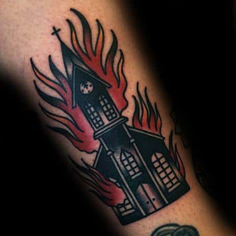 Traditional burning church tattoo with red and black flames rising around the steeple. Bold lines and classic style.