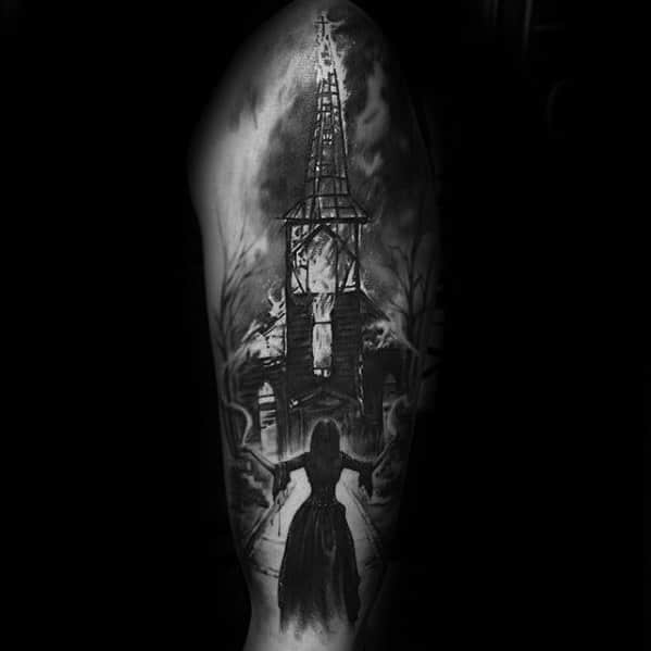 Realistic black and grey tattoo of a burning church with a woman in a long dress approaching it. Dark, eerie forest surrounds the scene.