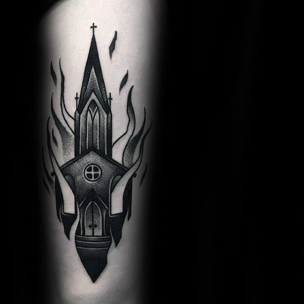 Black and grey burning church tattoo with clean shading and sharp lines. Flames rise around the steeple in a symmetrical design.
