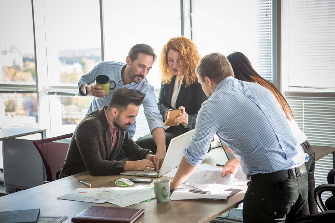 business people showing team work in board room