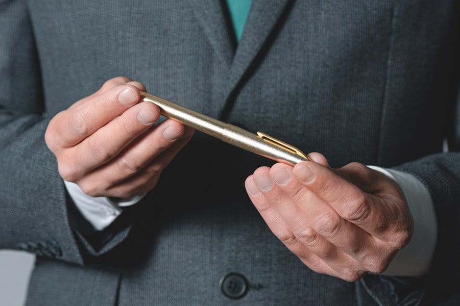 businessman holding a pen