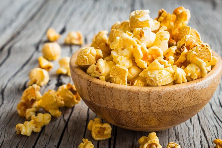 buttered popcorn in a wooden bowl