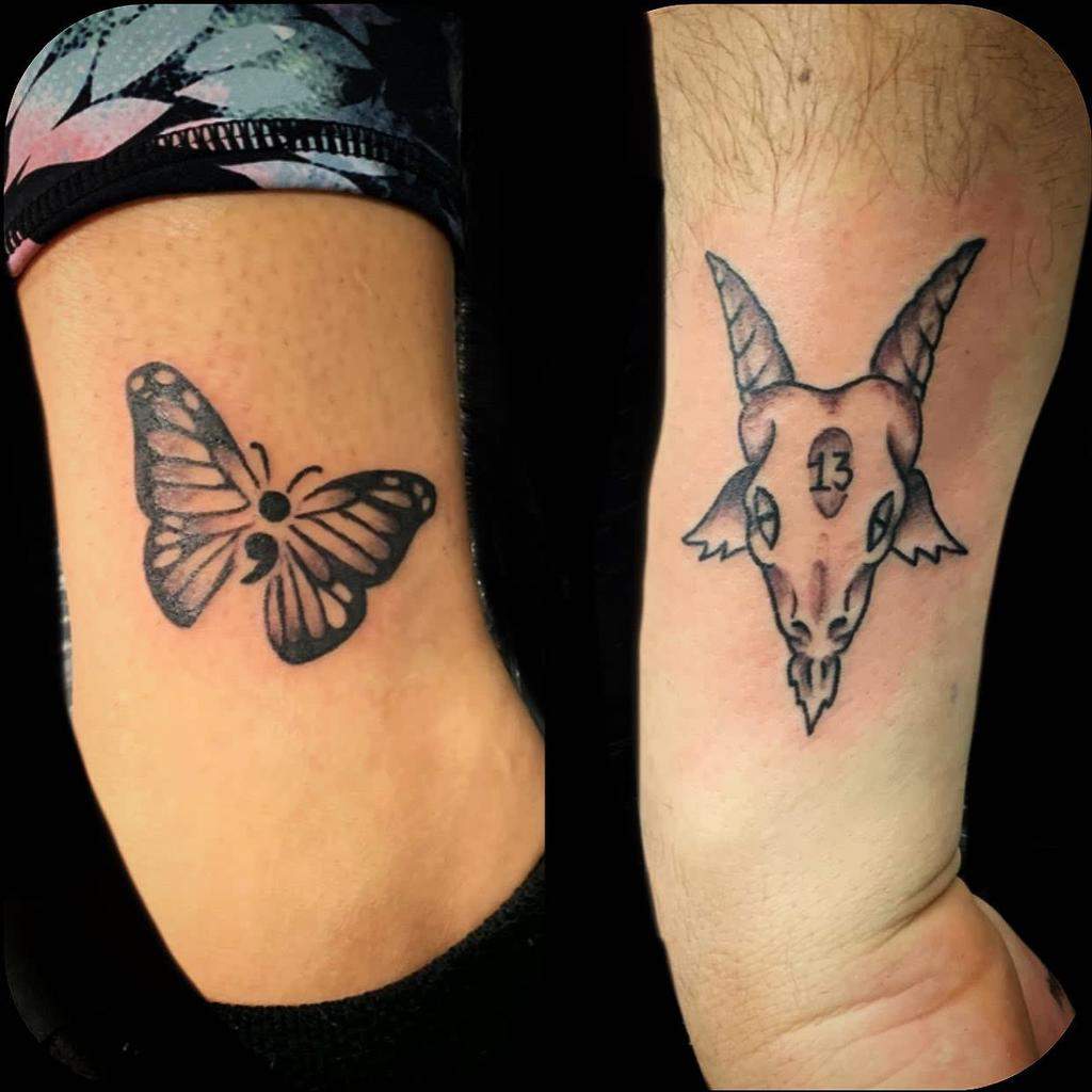 The tattoo features two distinct designs: a butterfly on the left forearm and a goat skull with the number 13 on the right, each adding a symbolic and unique touch to the arms.