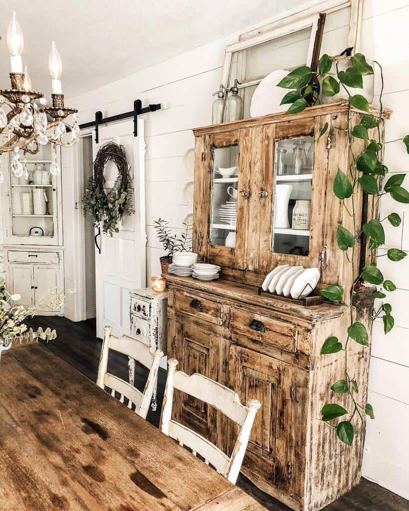rustic dining room wood cabinet wood dining room table white chairs sliding barn door 
