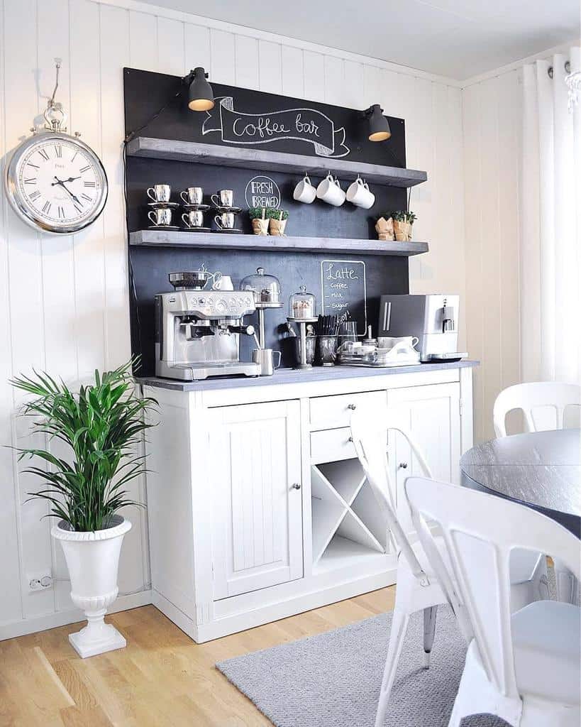 white and blue cabinet coffee machine table and chairs wall clock