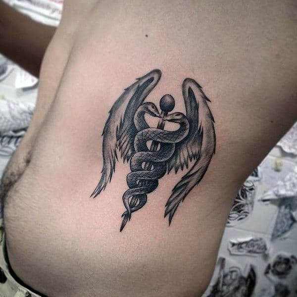 Caduceus With Angel Wings Male Rib Cage Side Of Body Tattoo