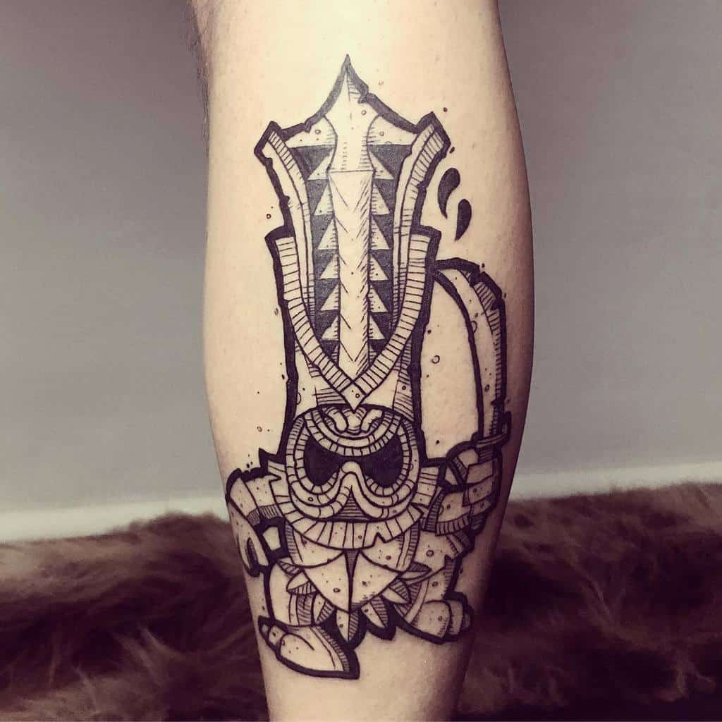 Black linework Tiki tattoo, featuring a stylized mask with geometric patterns, holding a large axe-like weapon and wearing tribal details