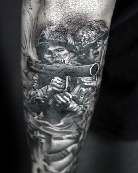 Realistic Call of Duty WWII soldier tattoo in black and grey, featuring detailed shading of troops in combat holding a bazooka on the forearm.