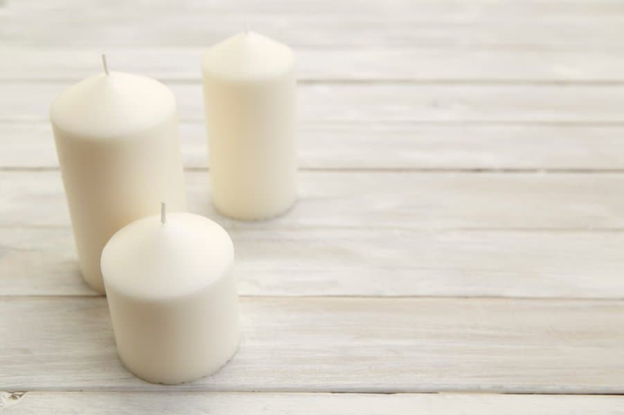 candles on old white wooden