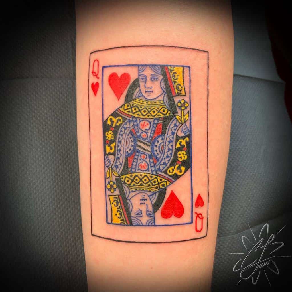 Tattoo of the Queen of Hearts playing card on an arm