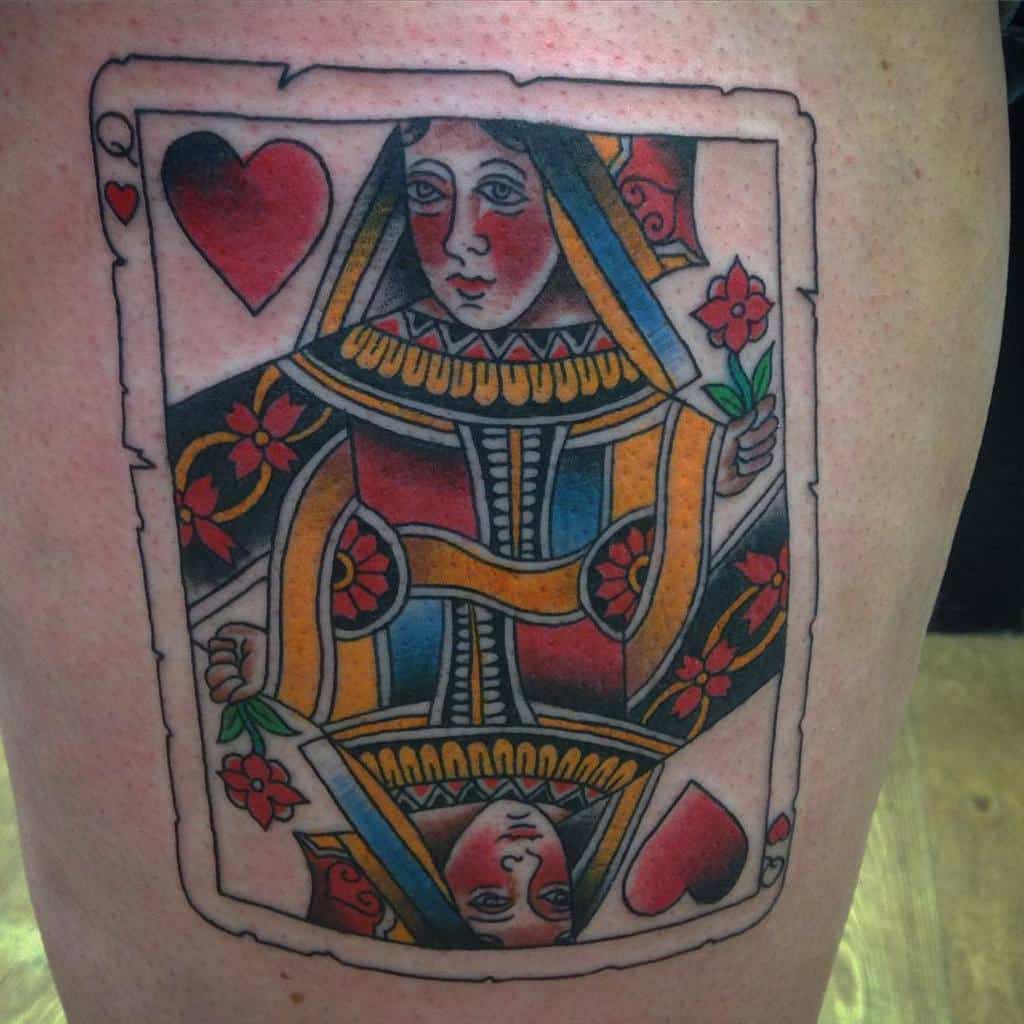 Tattoo of a Queen of Hearts playing card on skin
