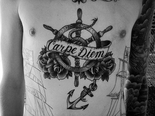 Carpe Diem Guys Ship Wheel Tattoo On Chest In Black Ink