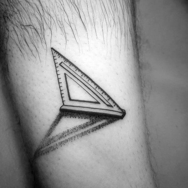 Minimalist tattoo of a triangular ruler with a shadow effect, symbolizing precision, geometry, and dedication to craftsmanship and design.