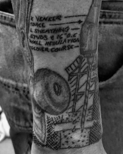 Black and gray tattoo featuring construction notes, a chisel, and a roll of tape, symbolizing precision, craftsmanship, and architectural design.