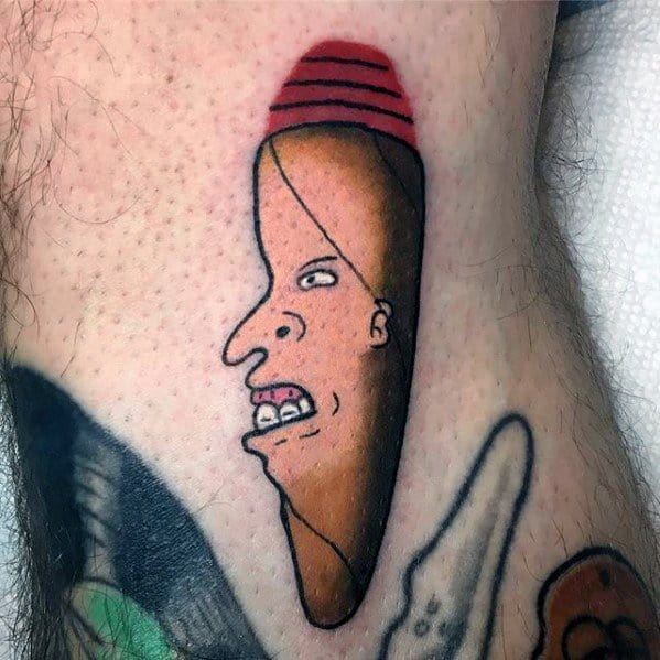 Funny and surreal tattoo of Beavis from Beavis and Butt-Head styled as a brown crayon with his signature red hat and exaggerated face.