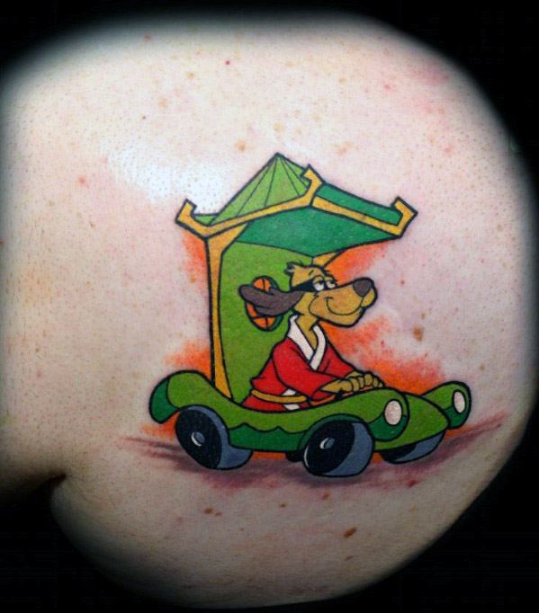 Colorful tattoo of Hong Kong Phooey driving his signature green car, wearing a red robe and smiling under the roof-like canopy.