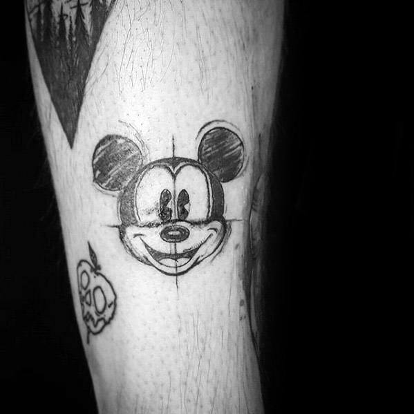 Black and white sketch-style tattoo of Mickey Mouse's face with visible construction lines, giving it a raw and hand-drawn look.