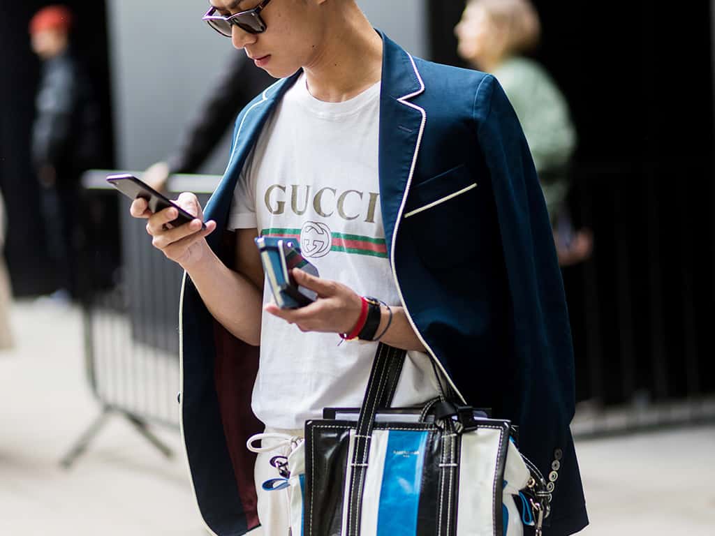This man smartly paired his casual logo t-shirt with dressier neutrals in shades of blue