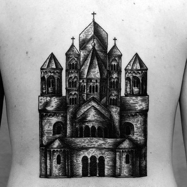 Back tattoo of a Romanesque-style cathedral with bold black linework, arched windows, towers, and cross-topped spires.
