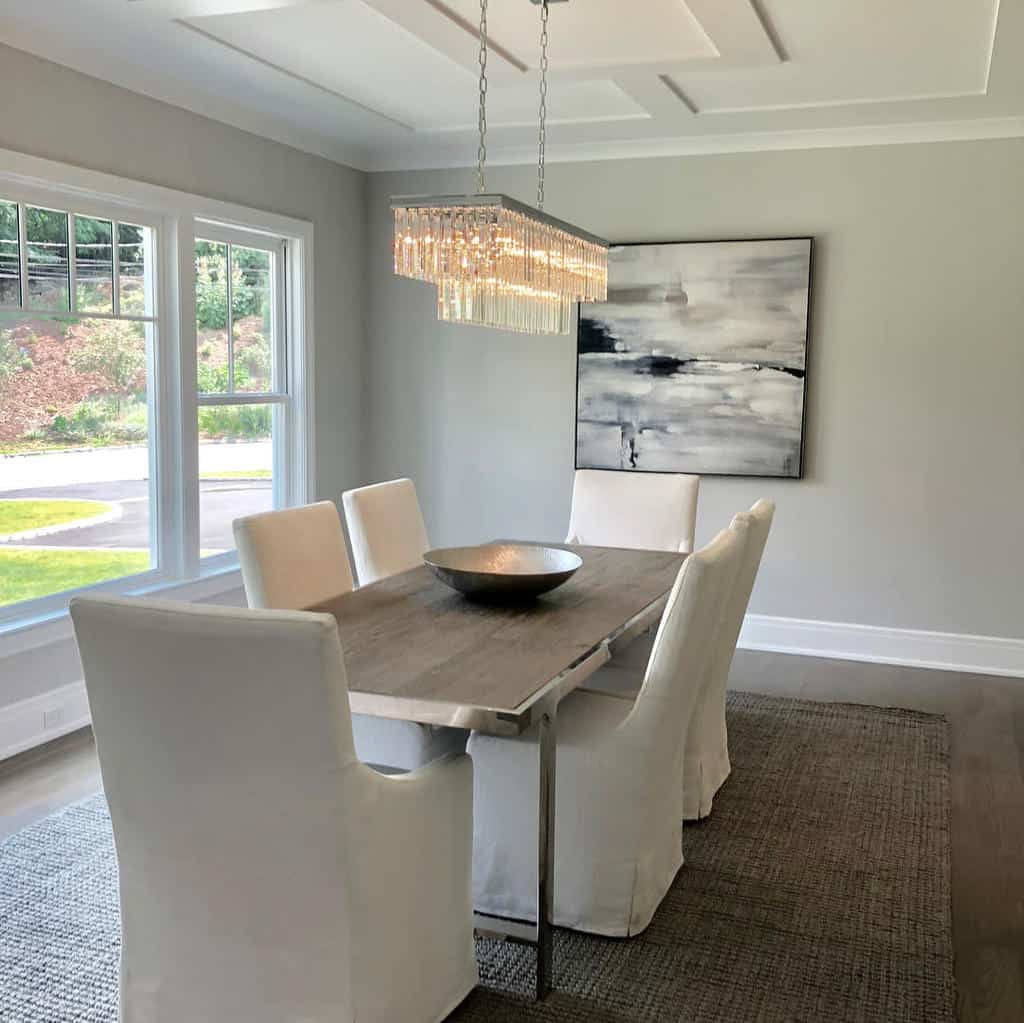 track lighting chandelier above dining room table