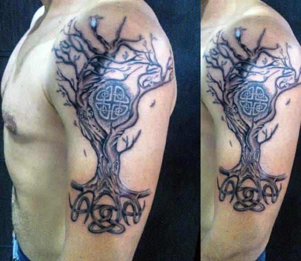 Tattoo of a tree with Celtic knots on an upper arm