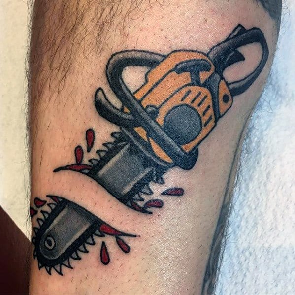 Cartoon-style chainsaw tattoo in orange and black, slicing through skin with red blood drops for a bold, graphic effect.