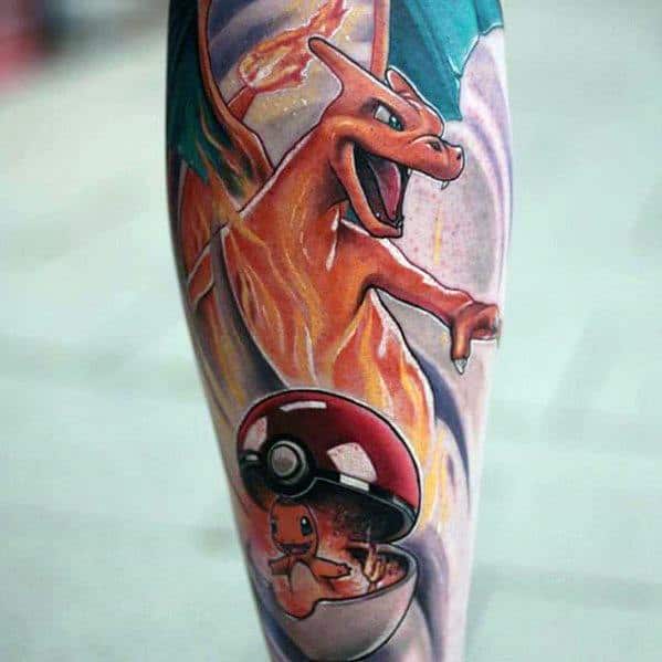 Vibrant Charizard tattoo showing its fiery evolution from Charmander in a Poké Ball, with flames and bold colors throughout.
