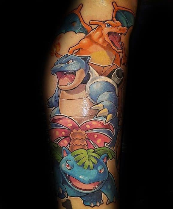 Vibrant tattoo of Charizard, Blastoise, and Venusaur stacked in a dynamic trio design, showcasing classic Pokémon power.