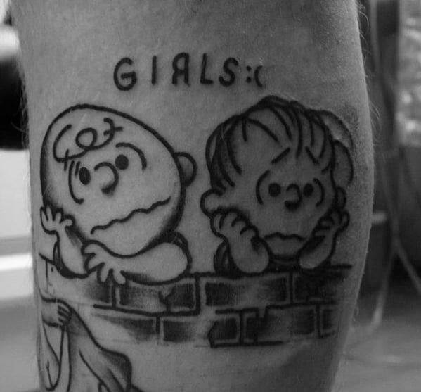 Black and white Charlie Brown and Linus tattoo, leaning on a brick wall with 'GIRLS :(' above, capturing classic Peanuts nostalgia.