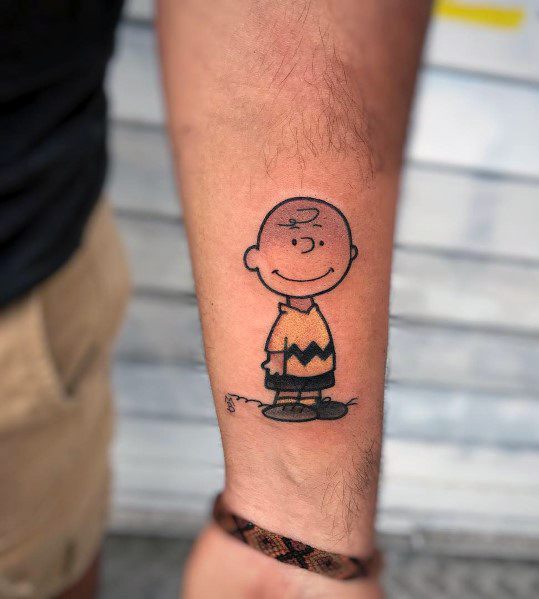Simple and clean Charlie Brown tattoo with bold outlines and classic details, capturing the timeless charm of the Peanuts character.