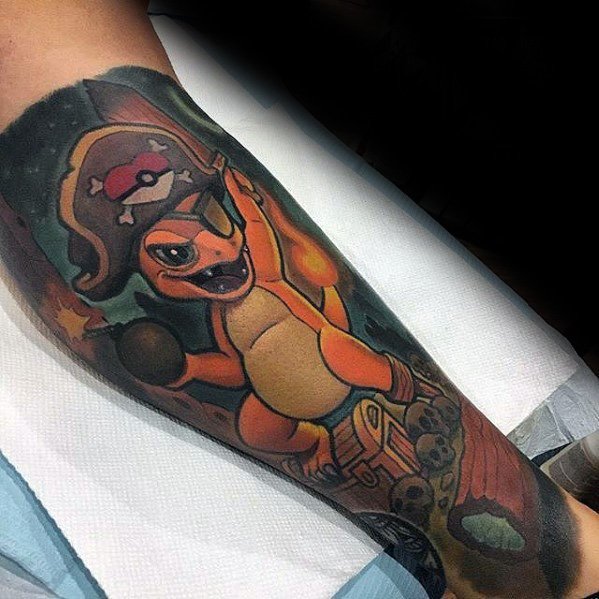 Pirate-themed Charmander tattoo with eye patch, bomb, and treasure chest, set in a dark adventure scene on the lower leg.
