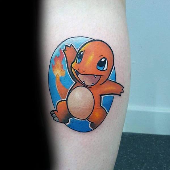 Cheerful Charmander tattoo inside a blue oval background, featuring bold outlines and a bright flame on its tail.