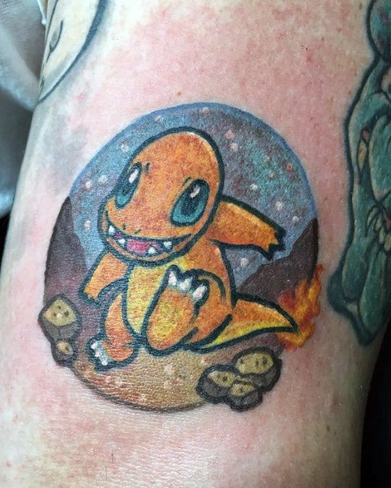 Playful Charmander tattoo set in a rocky night landscape with a starry sky, featuring bold lines and a cheerful expression.
