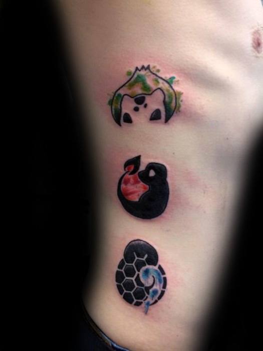 Minimalist side rib tattoo featuring Bulbasaur, Charmander, and Squirtle silhouettes with watercolor-style accents in green, red, and blue.