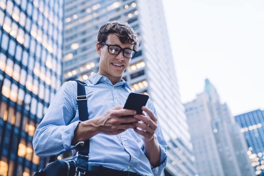 cheerful corporate employee enjoying online communication in group office chat