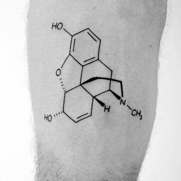 Tattoo of a chemical structure on a leg, featuring connected hexagons and lines