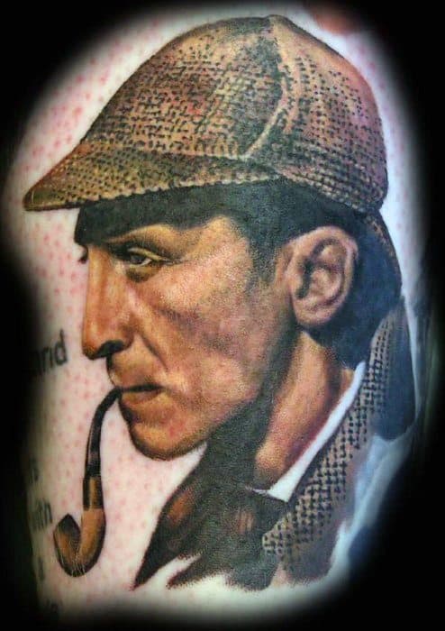 Tattoo of Sherlock Holmes in profile, with deerstalker hat and pipe against a blurred background